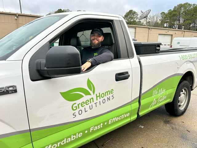 A Professional Inside A Green Home Solutions Company Truck 