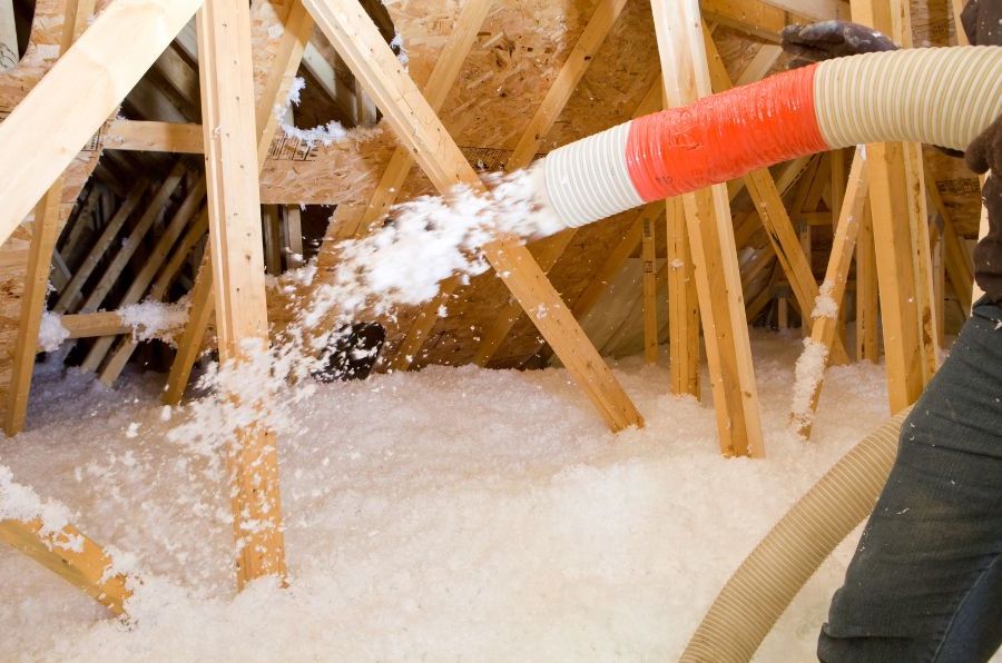 blown attic insulation around wood