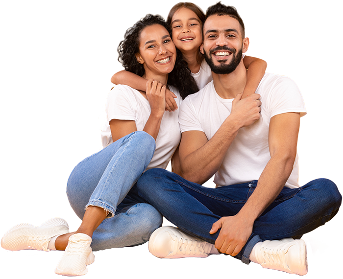 a family of three sitting on the floor with legs crossed